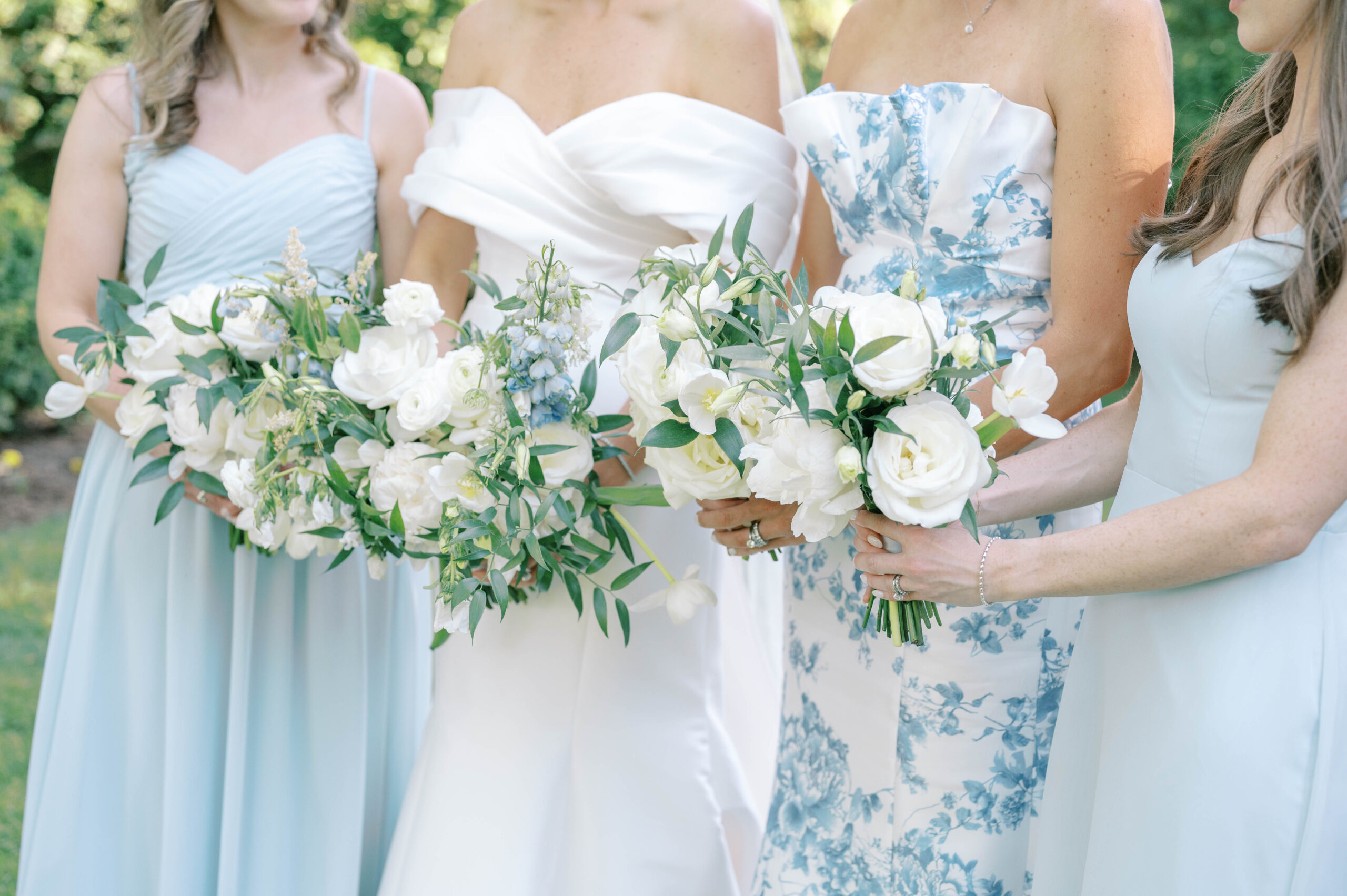 bride and bridesmaids holding their wedding bouquets in a wedding in DC
